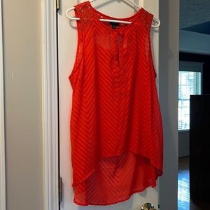 Partial open back.  Lower in back.  Embroidered on back